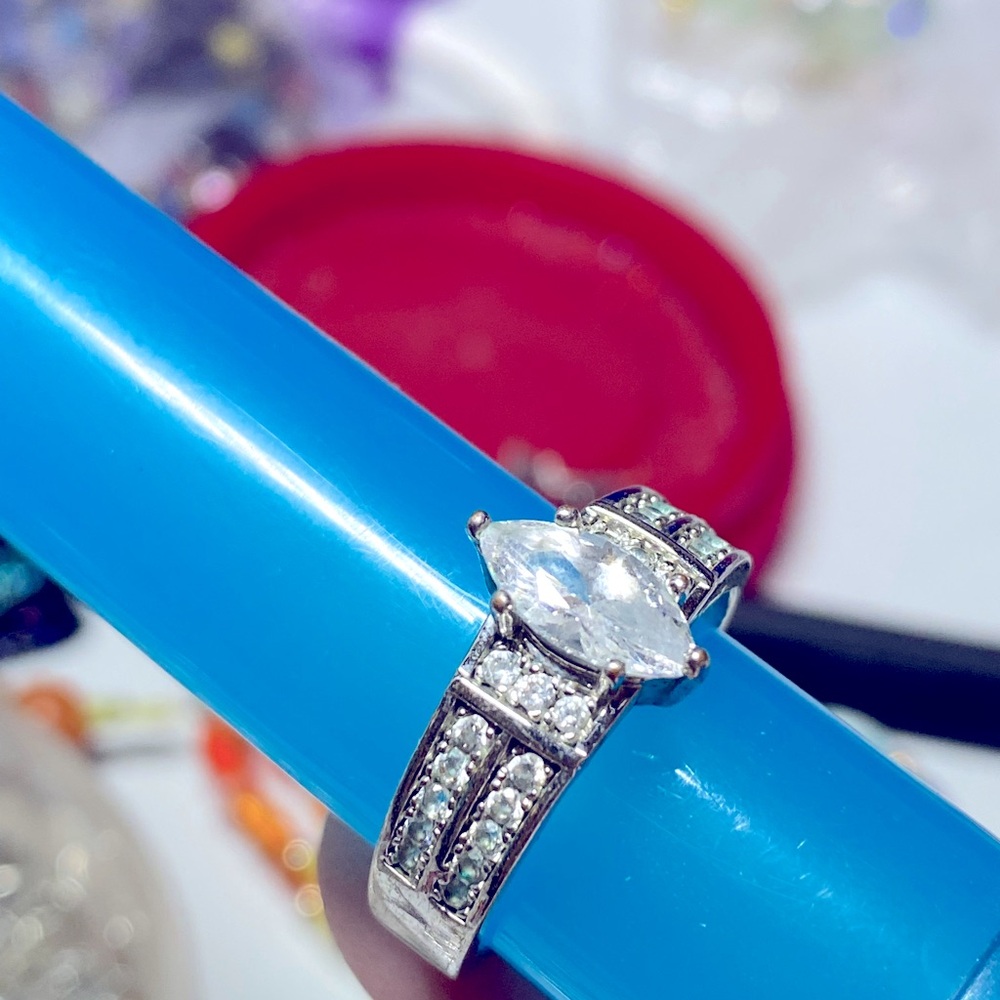 New. Faux diamond ring.,faux diamond chips on sides. Size 8